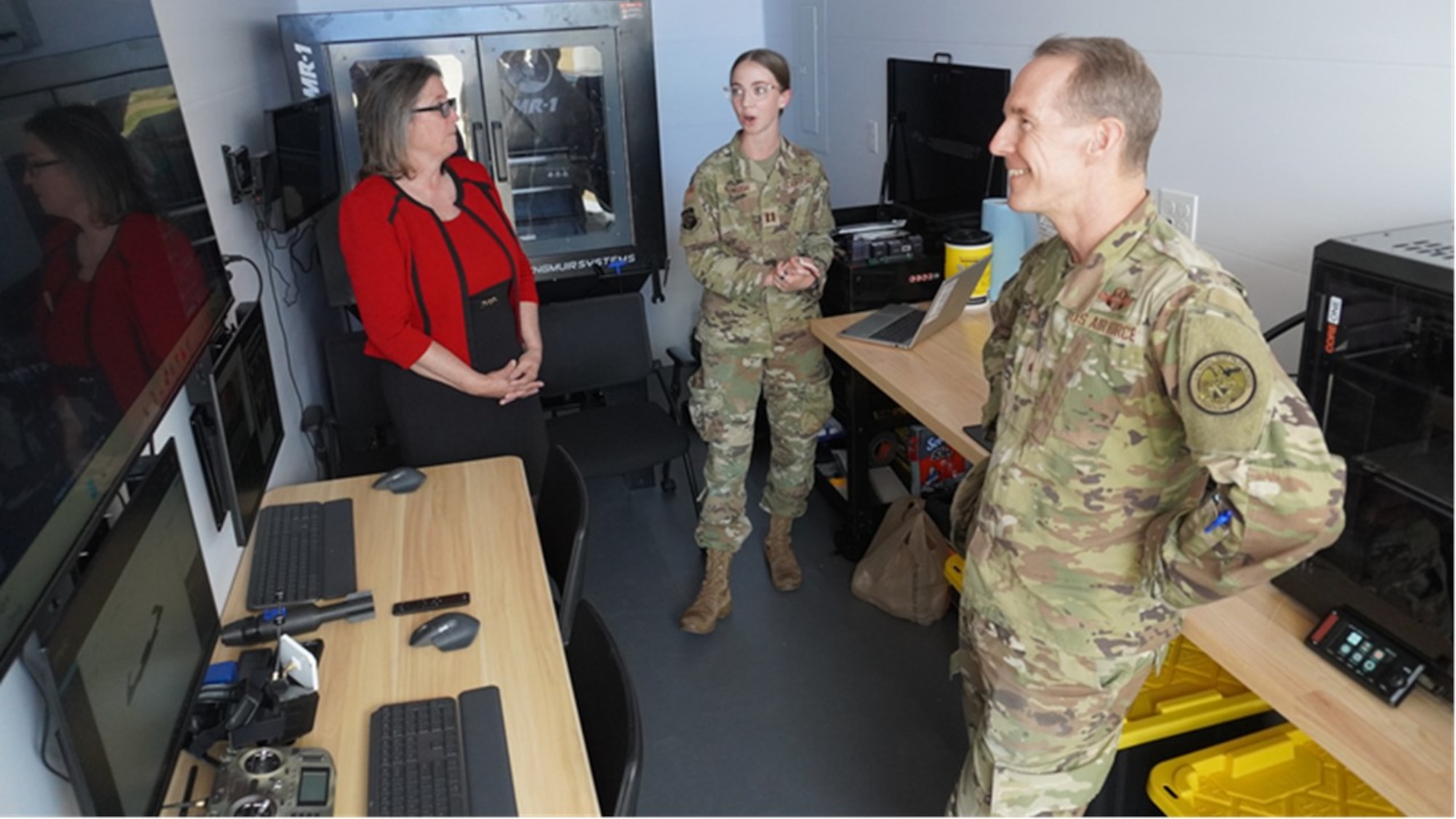 Brig. Gen. Wickert, commander, Air Force Research Laboratory, tours the Combat Laboratory (COLAB) site at Wright-Patterson Air Force Base, Ohio. COLABs are complete manufacturing and engineering labs built into 20-foot ISO shipping containers, serving as forward-deployed, localized, tactical maker spaces for the warfighter. Designed to expand frontline innovation capabilities, these mobile units allow teams to fabricate parts, repair equipment, and train personnel directly at the point of need. The Wright-Patterson AFB location is one of 18 COLAB sites deployed across the joint force to enhance tactical agility and self-sufficiency in austere environments. (U.S. Air Force photo)