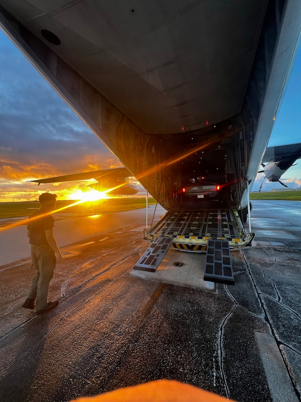 A U.S. Coast Guard HC-130J Hercules aircrew from Air Station Barbers Point conducts an overflight with a representative from the EPA and transports equipment to Rota in the Northern Mariana Islands on July 10, 2026. U.S. Coast Guard crews continue to assess and rectify discrepancies to aids to navigation, waterways, and channel conditions across the Marianas following Super Typhoon Bavi. (U.S. Coast Guard photo by Lt. j.g. Nomar Proctor)