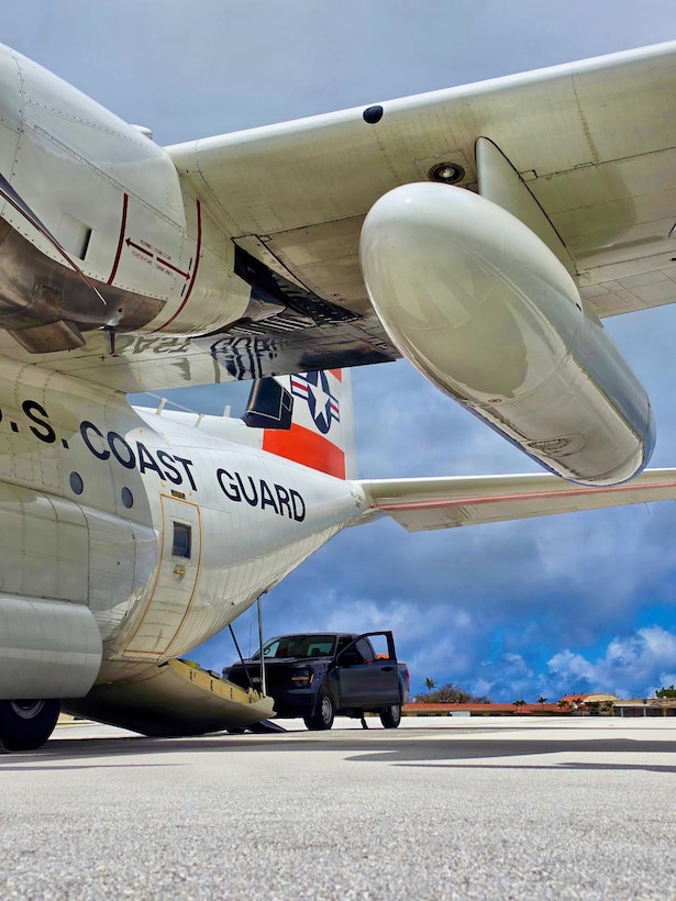 A U.S. Coast Guard HC-130J Hercules aircrew from Air Station Barbers Point conducts an overflight with a representative from the EPA and transports equipment to Rota in the Northern Mariana Islands on July 10, 2026. U.S. Coast Guard crews continue to assess and rectify discrepancies to aids to navigation, waterways, and channel conditions across the Marianas following Super Typhoon Bavi. (U.S. Coast Guard photo by Lt. j.g. Nomar Proctor)