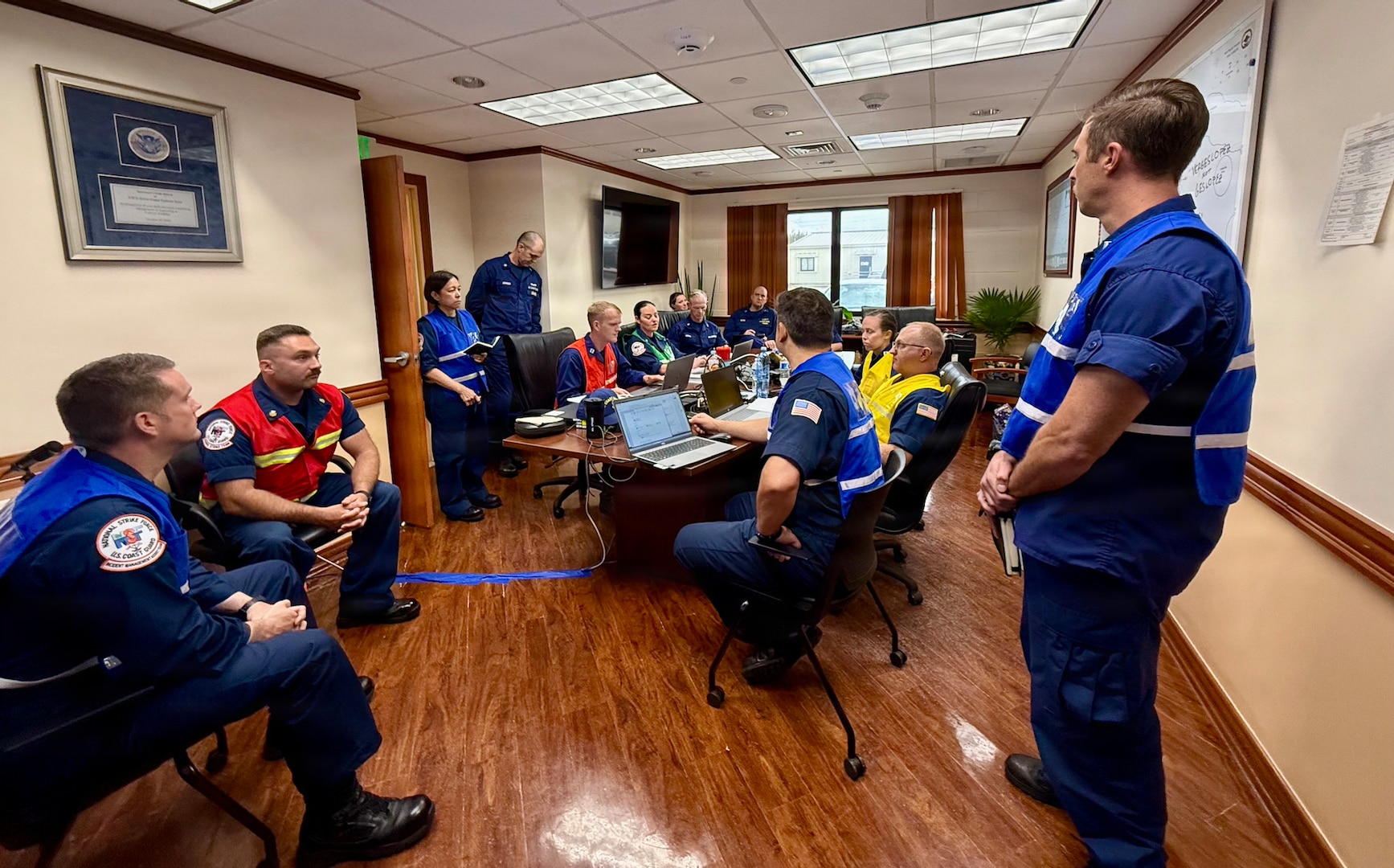 A U.S. Coast Guard Incident Management Team comprised of members from units around the country coordinates port recovery operations following Super Typhoon Bavi from U.S. Coast Guard Forces Micronesia/Sector Guam in Santa Rita, Guam, on July 11, 2026. U.S. Coast Guard crews continue to assess and rectify discrepancies to aids to navigation, waterways, and channel conditions across the Marianas following Super Typhoon Bavi. (U.S. Coast Guard photo by Mr. Sergio Cerda)