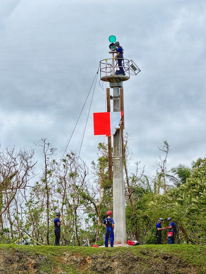 U.S. Coast Guard crews work to repair the Inner Apra Harbor rear range on July 11, 2026. Repairs are ongoing and weather- and equipment-dependent. The U.S. Coast Guard is coordinating with port partners to address already identified hazards and new issues following Super Typhoon Bavi. Multiple navigational aids are reportedly discrepant, off station, or simply missing. (U.S. Coast Guard photo by Lt. Sara Muir)