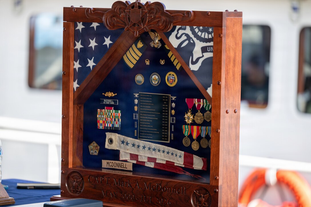 A shadowbox sits on display during the Coast Guard Sector Puget Sound change-of-command ceremony in Seattle, Washington, July 10, 2026