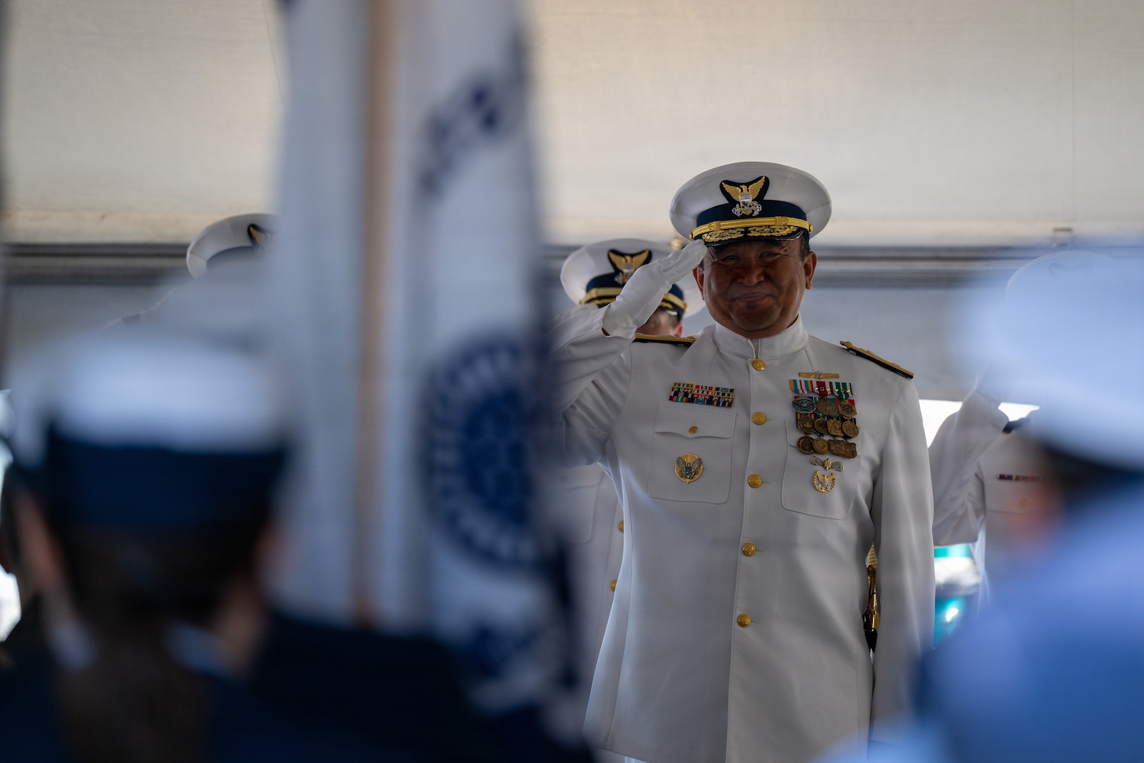 U.S. Coast Guard Rear Adm. Arex Avanni, commander, Coast Guard Northwest District, renders honors during the Coast Guard Sector Puget Sound change-of-command ceremony in Seattle, Washington, July 10, 2026.