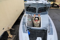 U.S. Army Command Sgt. Maj. Scott McKennon with the District of Columbia National Guard, assigned to Joint Task Force District of Columbia, in support of the DC Safe and Beautiful mission, enters the newly transferred 260th Special Purpose Brigade boat at Joint Base Anacostia-Bolling, June 26, 2026. About 4,500 National Guard members are supporting the mission, providing critical assistance to the Metropolitan Police Department to help ensure the safety of residents, commuters, and visitors throughout the District.