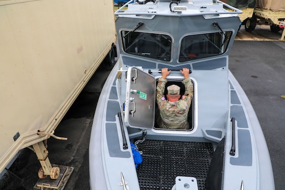 U.S. Army Command Sgt. Maj. Scott McKennon with the District of Columbia National Guard, assigned to Joint Task Force District of Columbia, in support of the DC Safe and Beautiful mission, enters the newly transferred 260th Special Purpose Brigade boat at Joint Base Anacostia-Bolling, June 26, 2026. About 4,500 National Guard members are supporting the mission, providing critical assistance to the Metropolitan Police Department to help ensure the safety of residents, commuters, and visitors throughout the District.