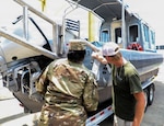 U.S. Army Sgt. Nigeria Myers with the District of Columbia National Guard, assigned to Joint Task Force District of Columbia, in support of the DC Safe and Beautiful mission, assesses the newly transferred 260th Special Purpose Brigade boat in Williamsburg, Va., June 26, 2026. About 4,500 National Guard members are supporting the mission, providing critical assistance to the Metropolitan Police Department to help ensure the safety of residents, commuters, and visitors throughout the District. (U.S. Army National Guard photo by Sgt. Keyra Moolenaar)