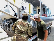 U.S. Army Sgt. Nigeria Myers with the District of Columbia National Guard, assigned to Joint Task Force District of Columbia, in support of the DC Safe and Beautiful mission, assesses the newly transferred 260th Special Purpose Brigade boat in Williamsburg, Va., June 26, 2026. About 4,500 National Guard members are supporting the mission, providing critical assistance to the Metropolitan Police Department to help ensure the safety of residents, commuters, and visitors throughout the District.
