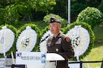 U.S. Army Brig. Gen. Jin Pak speaks at a podium during the sixth-anniversary commemoration ceremony for ROK Army Gen. Paik Sun Yup at the Dabu-dong War Memorial Museum in South Korea.