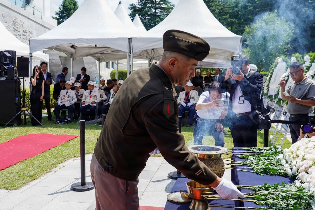 U.S. Army Brig. Gen. Jin Pak places a white flower on a memorial altar at the Dabu-dong War Memorial Museum in South Korea during a commemoration ceremony honoring the late ROK Army Gen. Paik Sun Yup.