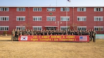 U.S. Marines with 3rd Maintenance Battalion, 3rd Marine Logistics Group, and Republic of Korea Marines pose for a photo before a sports day as part of the Korean Marine Exchange Program 26.1 in Pohang, South Korea, March 27, 2026. KMEP is a semi-annual exercise that provides opportunities for ROK Marine Corps and U.S. Marine Corps units to train together, improving their combined capabilities to deter threats and maintain peace on the Korean Peninsula. (U.S. Marine Corps photo by Cpl. Jessi Stegall)