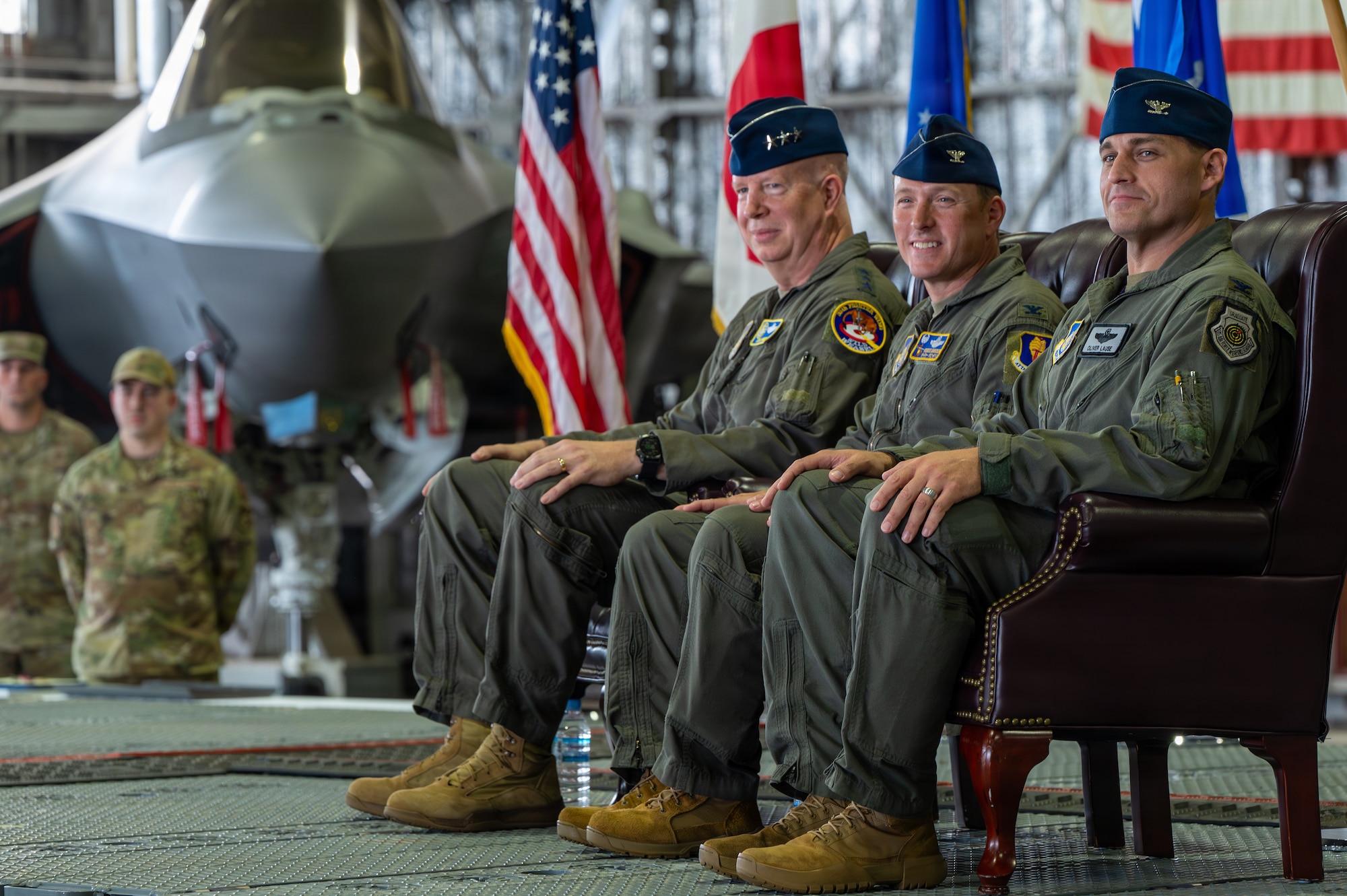 U.S. Air Force Lt. Gen. Joel Carey, left, 5th Air Force commander, Col. Paul Davidson, center, outgoing 35th Fighter Wing (FW) commander, and Col. Oliver Lause, incoming 35th FW commander, participate in the 35th FW change of command ceremony.