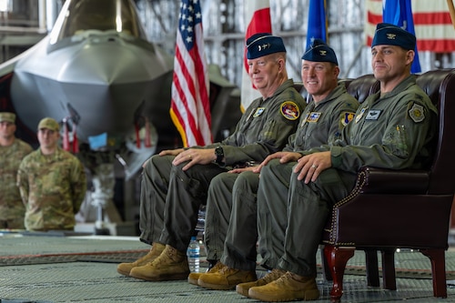 U.S. Air Force Lt. Gen. Joel Carey, left, 5th Air Force commander, Col. Paul Davidson, center, outgoing 35th Fighter Wing (FW) commander, and Col. Oliver Lause, incoming 35th FW commander, participate in the 35th FW change of command ceremony.
