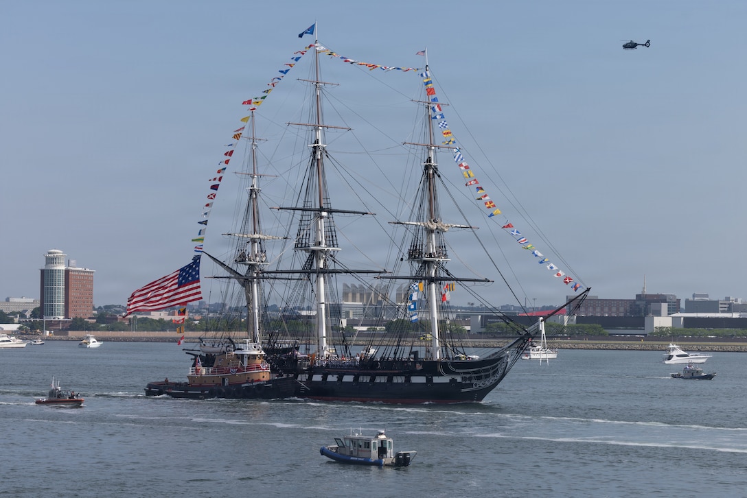 The USS Constitution sails during the SAIL250 Grand Parade of Sail Ceremony in Boston, Massachusetts, July 11, 2026. SAIL250 Boston celebrates America’s maritime heritage and the nation’s 250th anniversary by bringing together U.S. and international ships, Marines, Sailors, and community partners throughout the city. (U.S. Marine Corps photo by Lance Cpl. Michael Robinson)