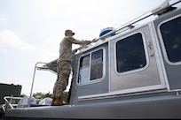 U.S. Army National Guard Spc. Luke Martinez Acuna, assigned to Joint Task Force- District of Columbia in support of the DC Safe and Beautiful mission, conducts Preventive Maintenance Checks and Services on a boat to ensure its mission capability on Joint Base Anacostia-Bolling in Washington, D.C., July 8, 2026.