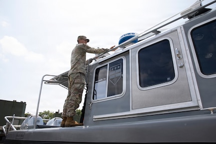 U.S. Army National Guard Spc. Luke Martinez Acuna, assigned to Joint Task Force- District of Columbia in support of the DC Safe and Beautiful mission, conducts Preventive Maintenance Checks and Services on a boat to ensure its mission capability on Joint Base Anacostia-Bolling in Washington, D.C., July 8, 2026.