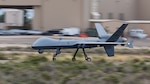 An MQ-9 Reaper assigned to the 9th Attack Squadron accelerates down a runway at Holloman Air Force Base, New Mexico, Aug. 27, 2025. Holloman Air Force Base is the primary training location for U.S. and allied MQ-9 student pilots and sensor operators, ensuring mission interoperability at home and abroad. (U.S. Air Force photo by Senior Airman Bob Teichmann)