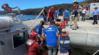 Pararescuemen from the California National Guard's 129th Rescue Wing's 131st Rescue Squadron transfer a patient onto land at Socorro Island, July 7, 2026.