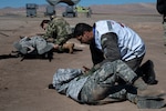 Brazilian and Paraguay air force medical service members respond to simulated injured service members for a mass casualty training during Exercise Salitre 2026 at Cerro Moreno Air Base in Antofagasta, Chile, July 7, 2026. Brazil and Paraguay participated alongside the U.S., Chile, and Colombia to enhance their combined readiness and ensure seamless integration for any future challenges. (U.S. Air Force photo by Tech. Sgt. Joshua Edwards)