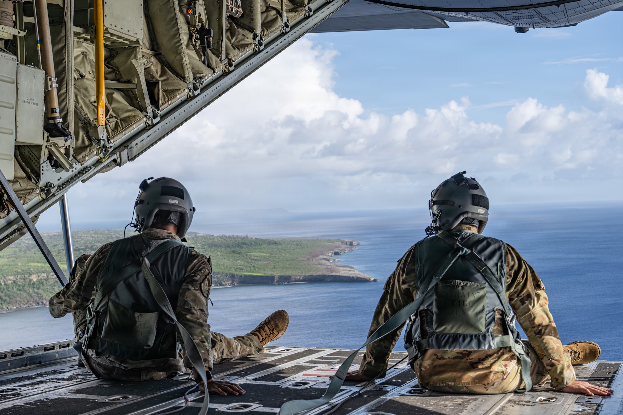 U.S. Air Force Staff Sgt. Darius Anthony, 39th Airlift Squadron advanced instructor loadmaster, and Airman 1st Class Samuel Hampton, 39th AS loadmaster, simulate sea rescue kit and Low Cost Low Altitude airdrops over the Philippine Sea, June 29, 2026, in support of VALIANT SHIELD 2026. Exercises like VALIANT SHIELD allow Pacific Command Joint Forces the opportunity to integrate forces from all branches of service and with our allies to conduct precise, lethal, and overwhelming multi-axis, multi-domain effects that demonstrate the strength and versatility of the joint force and our commitment to a free and open Indo-Pacific. (U.S. Air Force photo by Airman 1st Class Caleb Schellenberg)