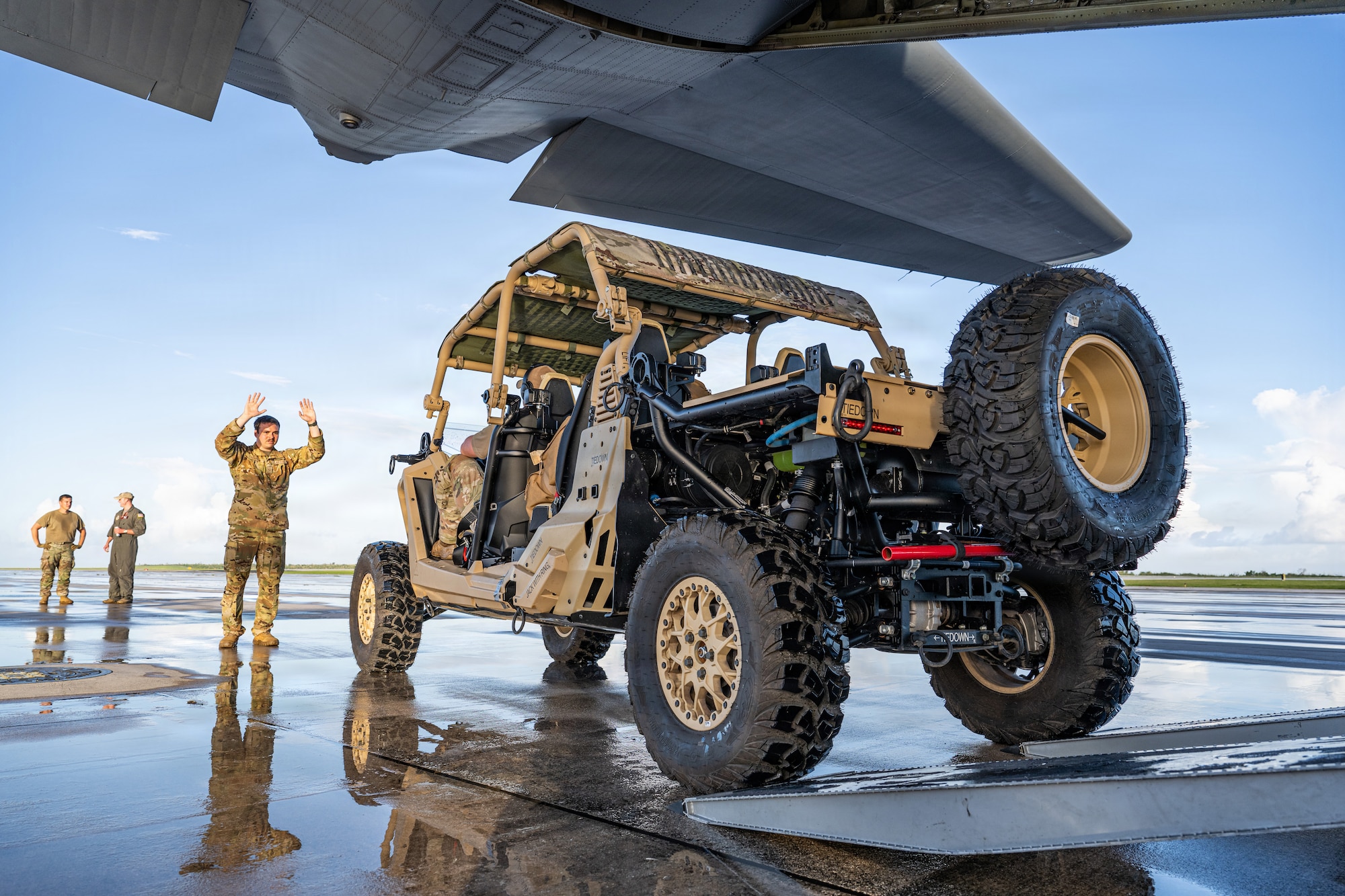 U.S. Air Force Airman 1st Class Samuel Hampton, 39th Airlift Squadron loadmaster, guides a Polaris MRZR onto a C-130J Super Hercules at Saipan International Airport, Northern Mariana Islands, June 29, 2026, in support of VALIANT SHIELD 2026. Exercises like VALIANT SHIELD allow Pacific Command Joint Forces the opportunity to integrate forces from all branches of service and with our allies to conduct precise, lethal, and overwhelming multi-axis, multi-domain effects that demonstrate the strength and versatility of the joint force and our commitment to a free and open Indo-Pacific. (U.S. Air Force photo by Airman 1st Class Caleb Schellenberg)