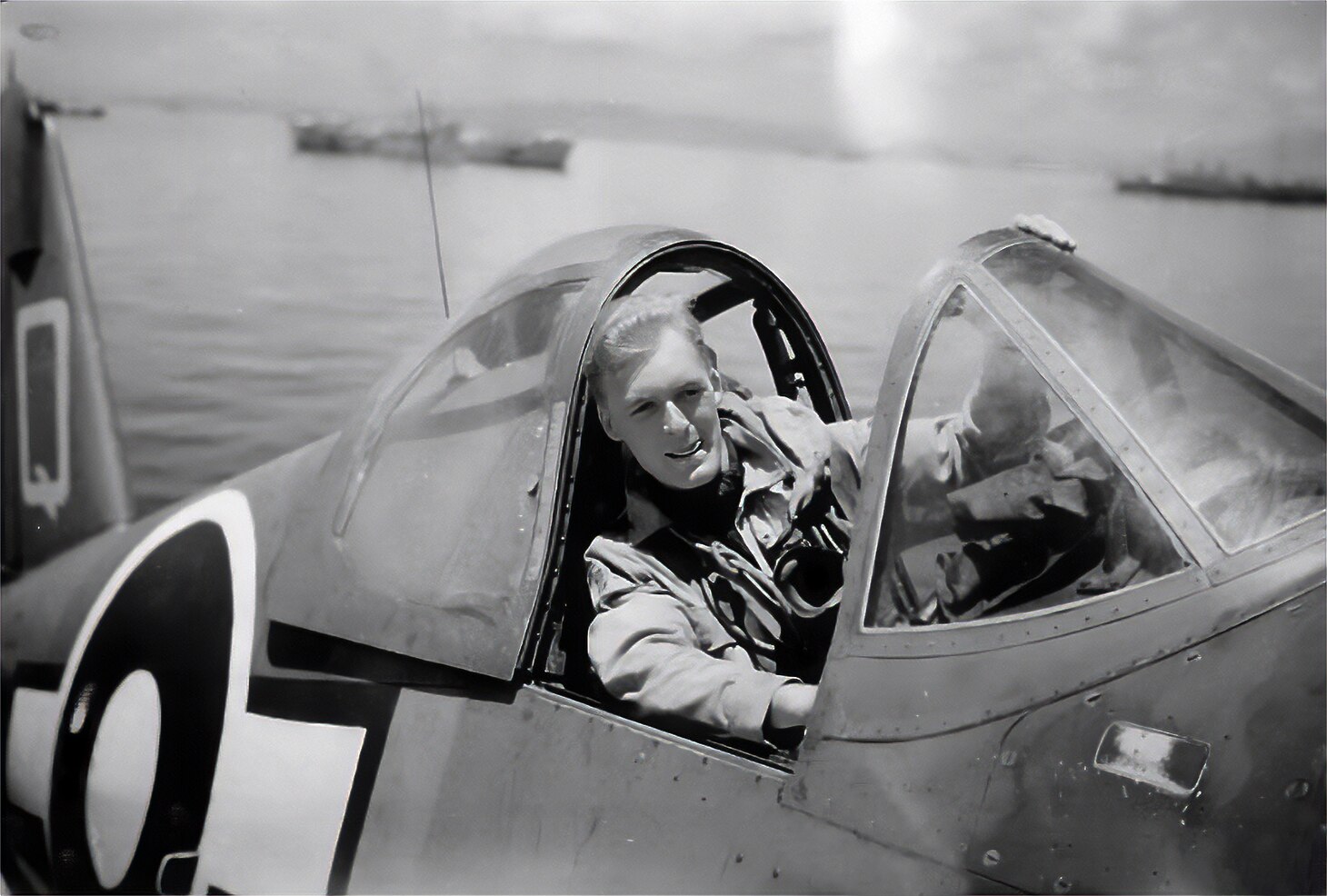 Sub Lt. (ensign in U.S. Navy terms) Gerry Salmon poses, “forced,” as he later called it, in his 1830 Squadron Corsair. He scored 1 ½ (i.e., shared) kills and was “mentioned in dispatches,” a uniquely British commendation marked by a certificate and special device rather than a dedicated medal.