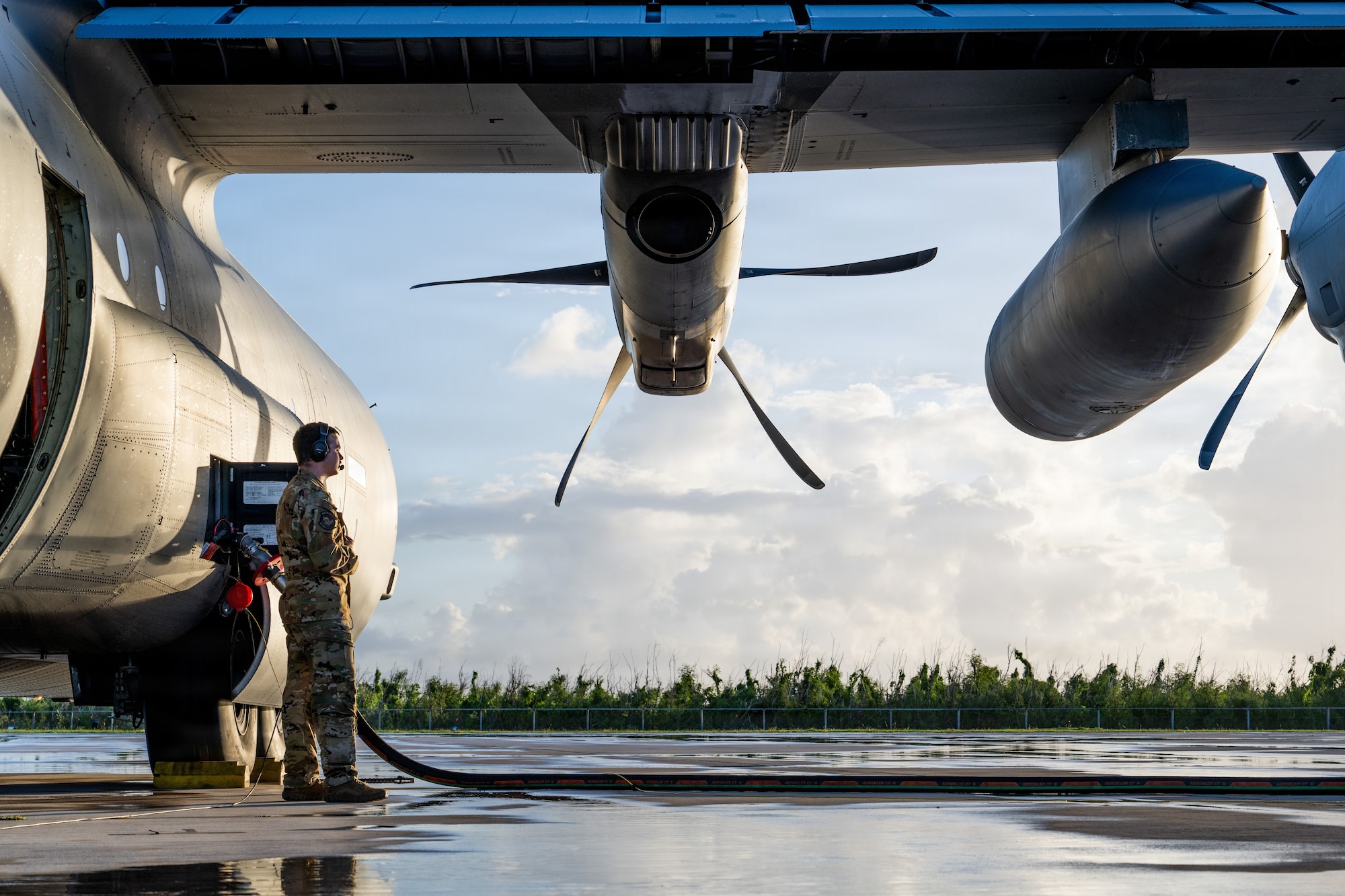 U.S. Air Force Airman 1st Class Samuel Hampton, 39th Airlift Squadron loadmaster, assists with refueling a C-130J Super Hercules at Saipan International Airport, Northern Mariana Islands, June 29, 2026, in support of VALIANT SHIELD 2026. Exercises like VALIANT SHIELD allow Pacific Command Joint Forces the opportunity to integrate forces from all branches of service and with our allies to conduct precise, lethal, and overwhelming multi-axis, multi-domain effects that demonstrate the strength and versatility of the joint force and our commitment to a free and open Indo-Pacific. (U.S. Air Force photo by Airman 1st Class Caleb Schellenberg)