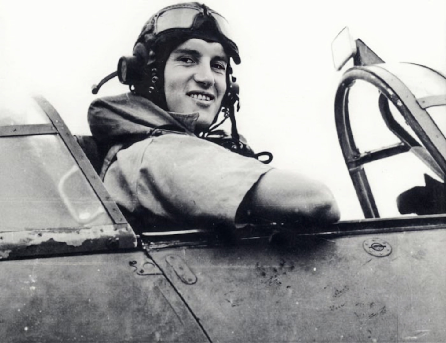 Lt. Cmdr. “Dickie” Cork (9 kills, including German, Italian and French aircraft) grins from the cockpit of his Sea Hurricane aboard his carrier HMS Indomitable as it makes its way back to England following the conclusion of Operation Pedestal (Aug. 2-15, 1942) to relieve embattled Malta.