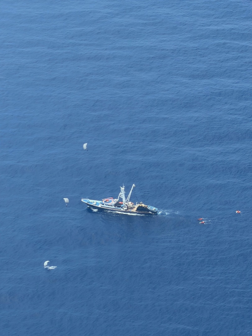 Pararescuemen from the 131st Rescue Squadron prepare to board the Mexican fishing vessel Franz, after jumping from the 129th Rescue Wing's HC-130J Combat King II, on July 7, 2026.
