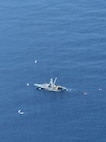 Pararescuemen from the 131st Rescue Squadron prepare to board the Mexican fishing vessel Franz, after jumping from the 129th Rescue Wing's HC-130J Combat King II, on July 7, 2026.