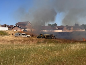 U.S. Air Force 9th Civil Engineering Squadron and Beale’s Wildland Fire Support Module perform a prescribed burn near base housing at Beale Air Force Base, California, June 1, 2026. The proactive operation was designed to prevent catastrophic events like the 1,000-acre Intanko Fire in 2021, which forced the evacuation of 1,125 personnel and threatened 375 homes. (Courtesy photo)