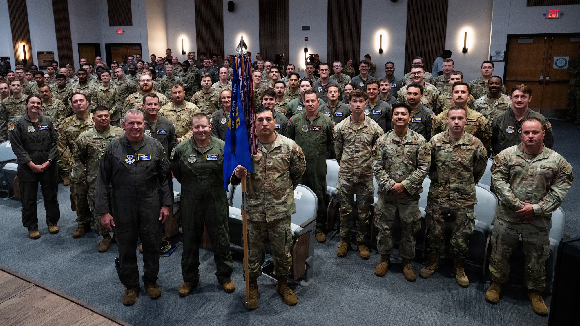 U.S. Air Force Maj. Gen. Charles Bolton, front-left, Eighteenth Air Force commander, and Airmen assigned to the 40th Airlift Squadron pose for a group photo after Bolton presented the Gallant Unit Citation to the 40th AS at Dyess Air Force Base, Texas, July 7, 2026. The award is presented to Air Force active duty, Reserve and Air National Guard units for extraordinary heroism in action against an armed enemy of the United States while engaged in military operations involving conflict with an opposing foreign force on or after Sept. 11, 2001. (U.S. Air Force photo by Senior Airman Jade M. Caldwell)