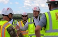 U.S. Sen. Pete Ricketts talks to Col. Robert Newbauer, U.S. Army Corps of Engineers, Omaha District commander, and other project leaders during a tour of rehabilitation efforts on the R-562 levee system June 15, 2026.