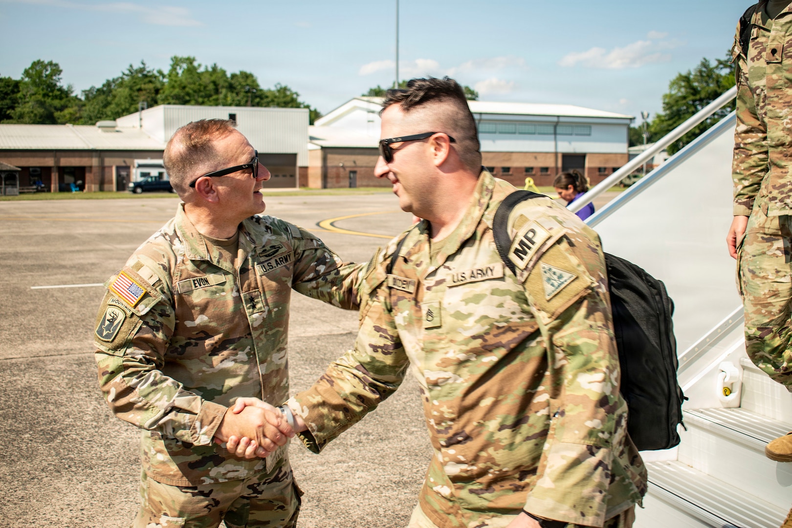 U.S. Army Maj. Gen. Francis J. Evon Jr., the adjutant general of the Connecticut National Guard, greets Soldiers assigned to 643rd Military Police Company as they disembark an aircraft at Bradley Air National Guard Base, East Granby, Connecticut, July 11, 2026.