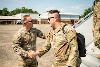 U.S. Army Maj. Gen. Francis J. Evon Jr., the adjutant general of the Connecticut National Guard, greets Soldiers assigned to 643rd Military Police Company as they disembark an aircraft at Bradley Air National Guard Base, East Granby, Connecticut, July 11, 2026.