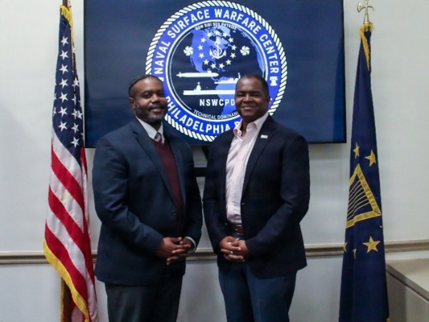Deputy Senior Competency Manager of Production Innovation and Materiel Readiness Engineering at Naval Information Warfare Center Atlantic, Kenric W. “Rick” Johnson (left) visits NSWCPD to shadow Technical Director, Nigel C. Thijs, SES, as part of the Department of the Navy’s Bridging the Gap Leadership Development Program. (U.S. Navy photo by Margaret A. Kenyon)