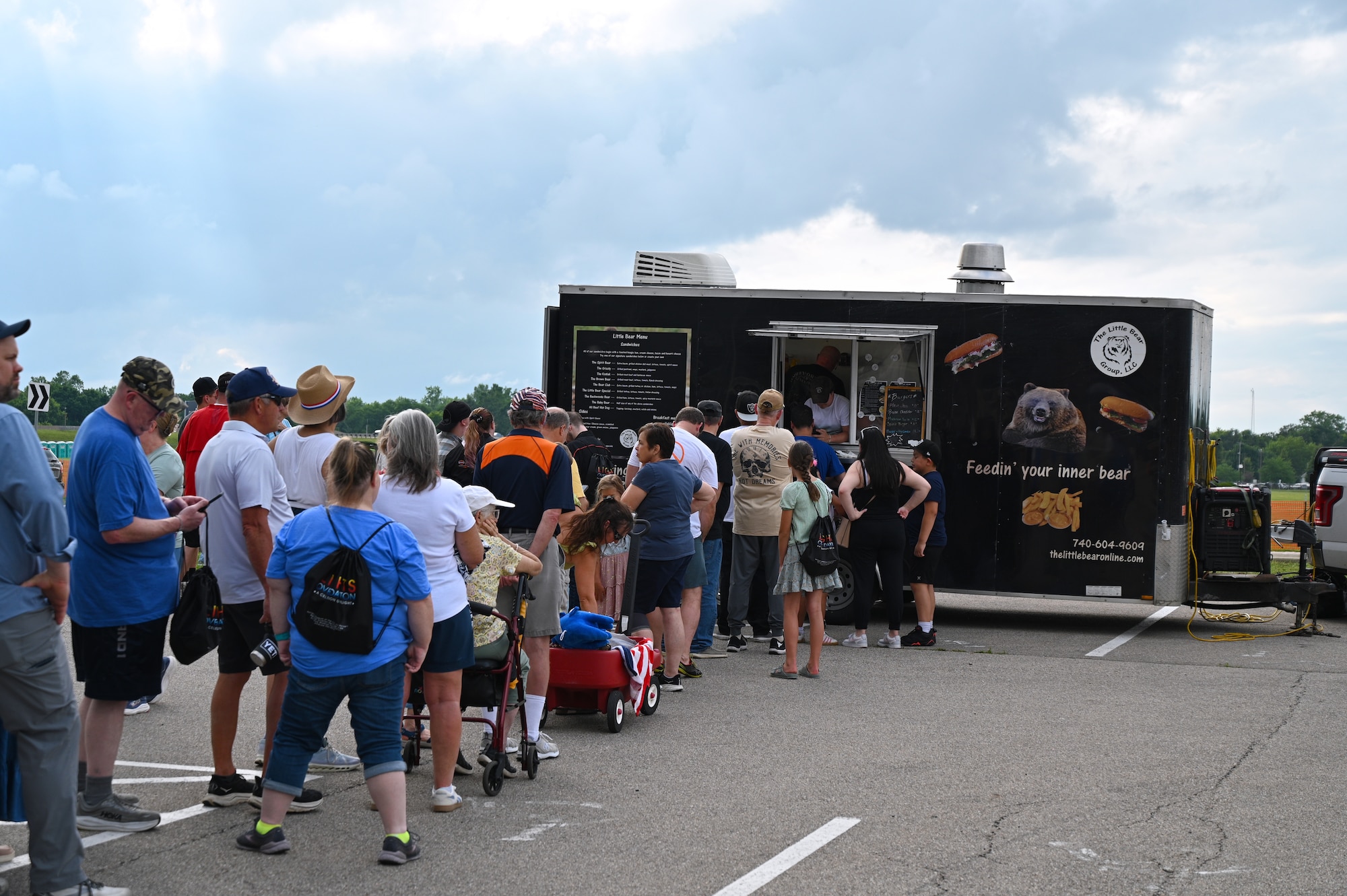 Visitors line up at food trucks during the afternoon as the campus welcomed guests throughout the day.