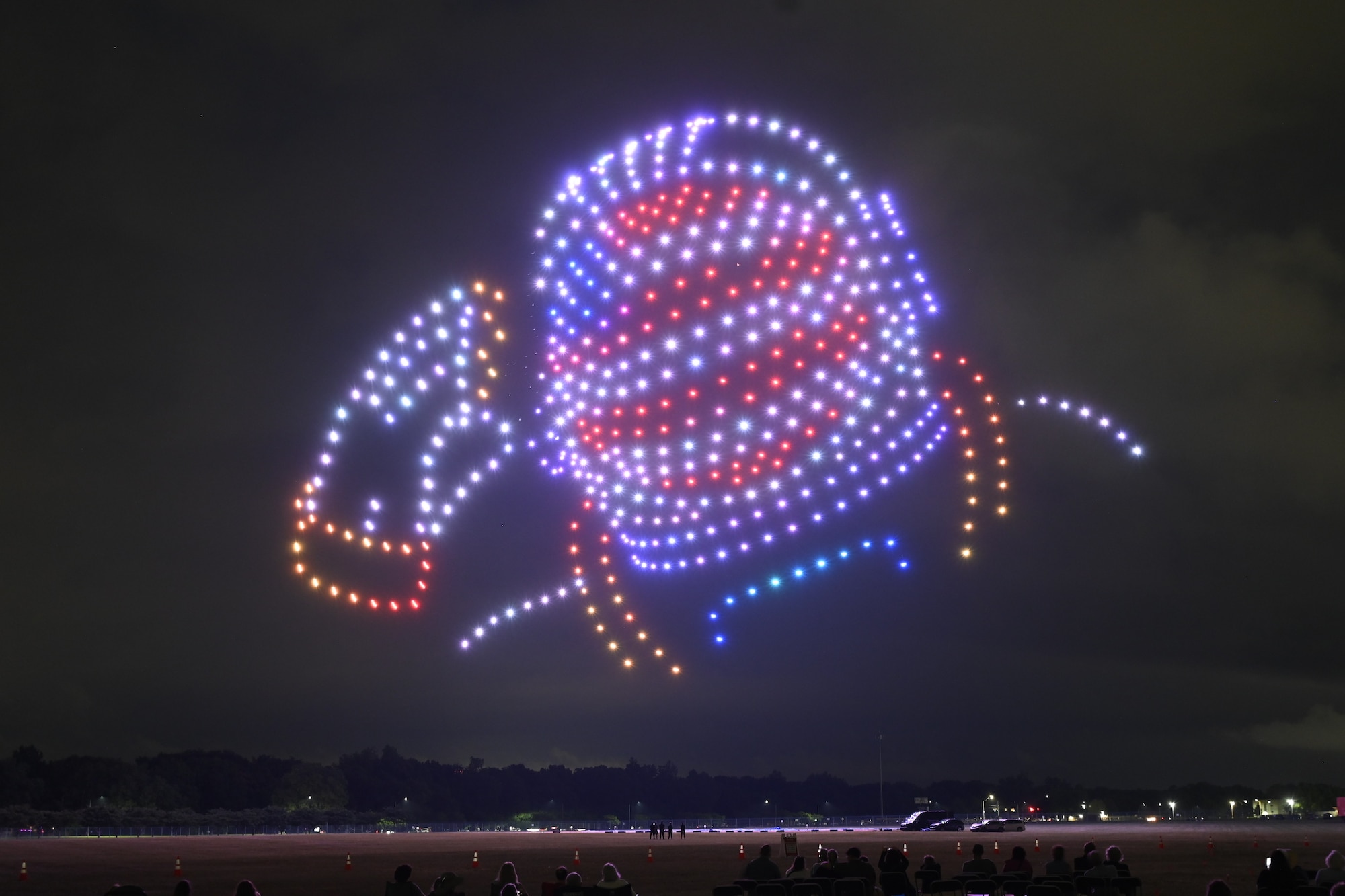 Illuminated drones create the image of an astronaut representing Ohio native Neil Armstrong during the Lights Over Dayton drone show.