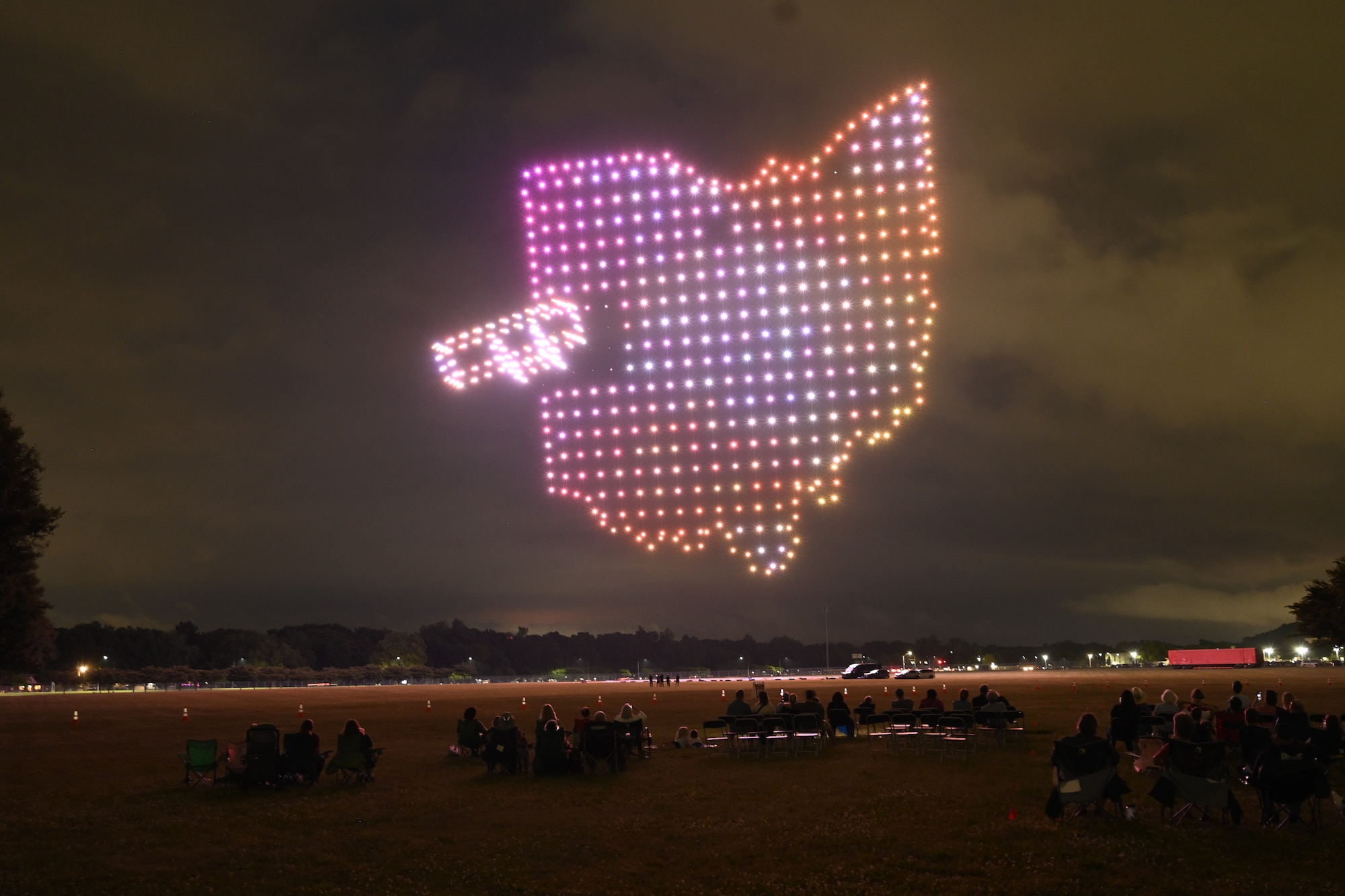 A formation of illuminated drones creates the outline of the state of Ohio during the Lights Over Dayton drone show.