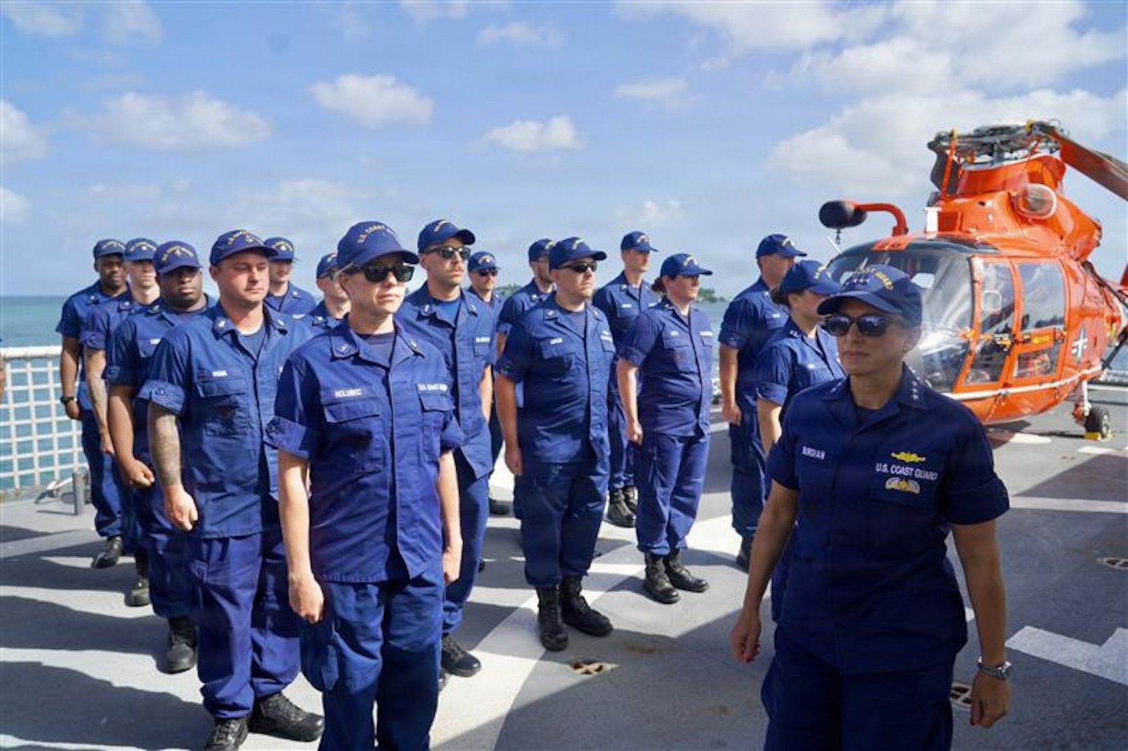 U.S. Coast Guard crewmembers aboard Coast Guard Cutter James, stand at parade rest during a change of command ceremony in Key West, Florida July 9, 2026. The James is one of four 418-foot Legend-class national security cutters homeported in Charleston, South Carolina, under U.S. Coast Guard Atlantic Area Command. (U.S. Coast Guard photo)