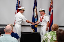 Lt. Cmdr. Michael Johnson relieved Cmdr. Nathan Battle as NUWC Division, Keyport Detachment Pacific’s new officer in charge during a Change of Charge ceremony at the Navy Lodge on Ford Island, July 10. NUWC Division, Keyport Commanding Officer Capt. Brandon Monaghan served as presiding officer speaker.