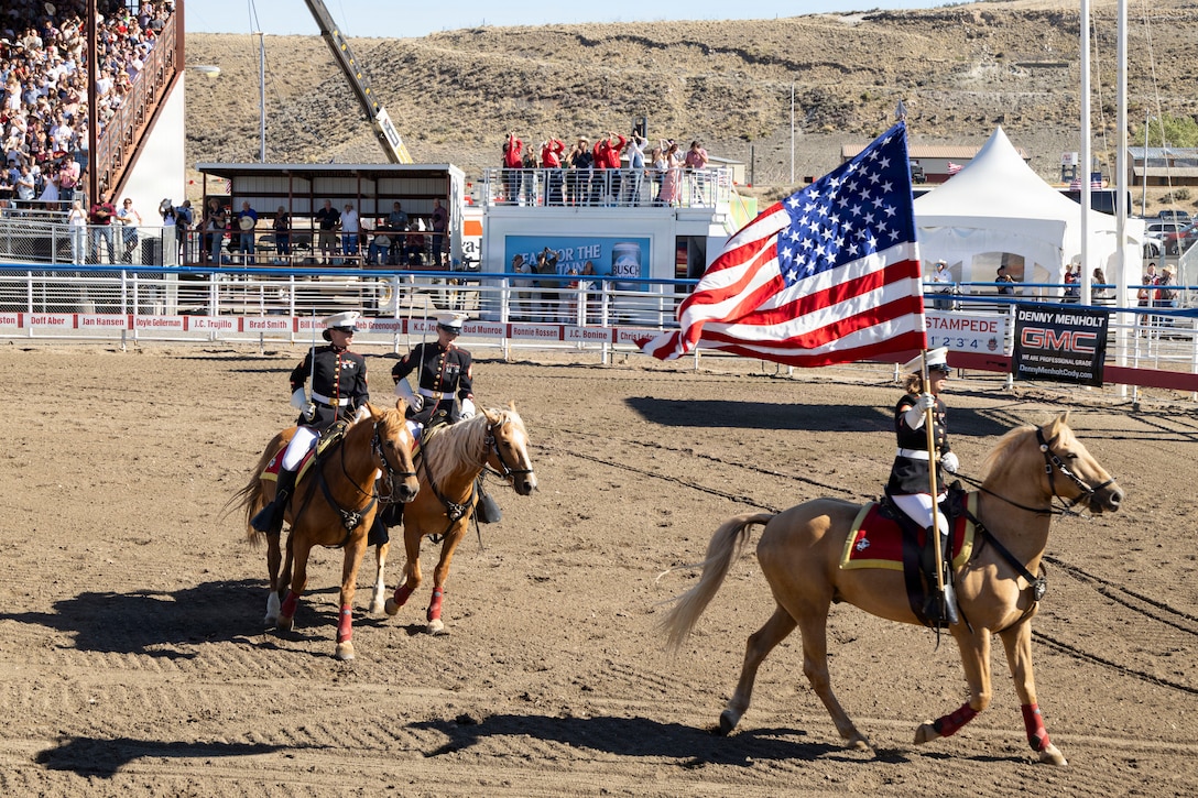 The U.S. Marine Corps Mounted Color Guard presents the national colors during the Cody Stampede Rodeo at Cody, Wyoming, July 4, 2026. As the last remaining mounted color guard in the Marine Corps, the unit’s participation in the Cody Stampede showcased Marine Corps tradition, professionalism and horsemanship. (U.S. Marine Corps photo by Sgt. Davin Tenbusch)