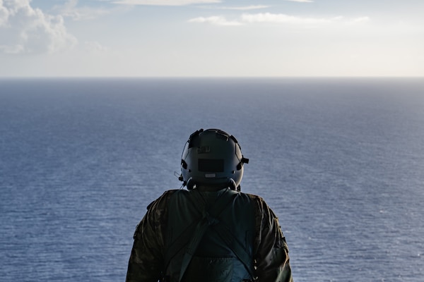 U.S. Air Force Airman 1st Class Samuel Hampton, 39th AS loadmaster, simulates sea rescue kit and Low Cost Low Altitude airdrops over the Philippine Sea, June 29, 2026, in support of VALIANT SHIELD 2026. Exercises like VALIANT SHIELD allow Pacific Command Joint Forces the opportunity to integrate forces from all branches of service and with our allies to conduct precise, lethal and overwhelming multi-axis, multi-domain effects that demonstrate the strength and versatility of the joint force and our commitment to a free and open Indo-Pacific. (U.S. Air Force photo by Airman 1st Class Caleb Schellenberg)
