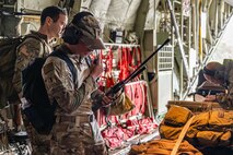 U.S. service members board a C-130J Super Hercules at Ngeaur Island, Palau, June 25, 2026, in support of VALIANT SHIELD 2026. Exercises like VALIANT SHIELD allow Pacific Command Joint Forces the opportunity to integrate forces from all branches of service and with our allies to conduct precise, lethal and overwhelming multi-axis, multi-domain effects that demonstrate the strength and versatility of the joint force and our commitment to a free and open Indo-Pacific. (U.S. Air Force photo by Airman 1st Class Caleb Schellenberg)