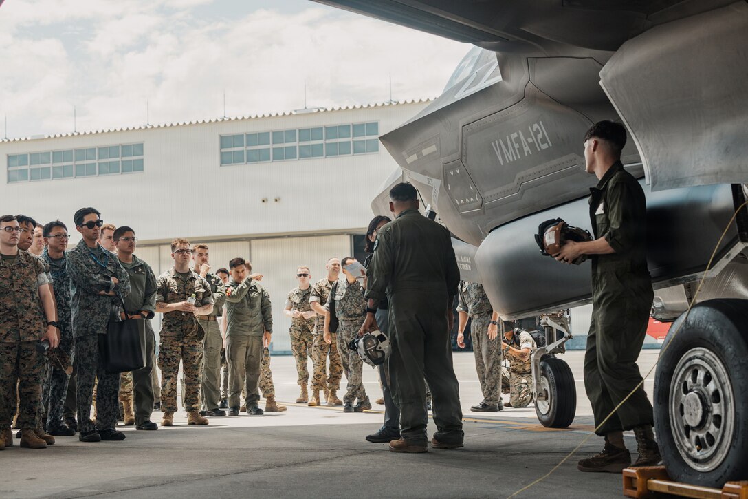 U.S. Marines stationed across the Indo-Pacific region and allied nations, examine a F-35B Lightning II aircraft assigned to Marine Fighter Attack Squadron (VMFA) 121, Marine Aircraft Group 12, 1st Marine Aircraft Wing, during Crash Damaged or Disabled Aircraft Recovery training at Marine Corps Air Station Iwakuni, Japan, June 1. 2026. CDDAR training is an annual training event held at MCAS Iwakuni by the F-35 Joint Program Office to bring multiple nations together to enhance aircraft recovery, rescue techniques, and capabilities across North Atlantic Treaty Organization Allies. (U.S. Marine Corps photo by Cpl. Sarah Grawcock)