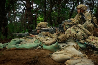 Soldiers assigned to Bravo Company, 4th Battalion, 23rd Infantry Regiment establish a support-by-fire position during platoon live fire exercises at Rodriguez live fire complex in South Korea, July 8, 2026.