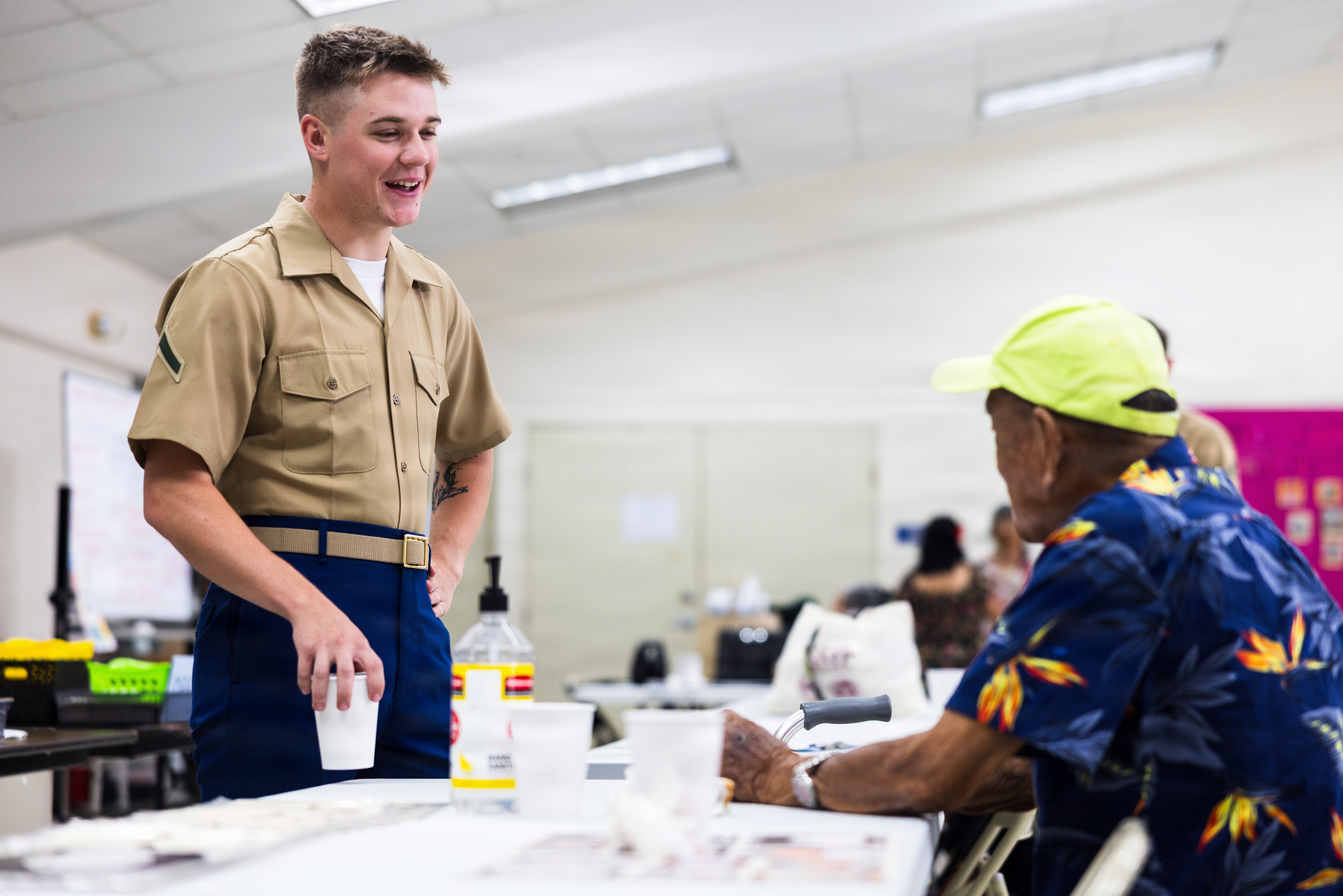 U.S. Marine Corps Pfc. Andrew Hays, network administrator, Marine Corps Base Camp Blaz, speaks to a senior citizen during a community relations event in Astumbo, Guam, June 26, 2026. The event provided Marines an opportunity to build relationships with the local community through conversation, volunteer service, and meaningful engagement. (U.S. Marine Corps photo by Sgt. Brayden Daniel)