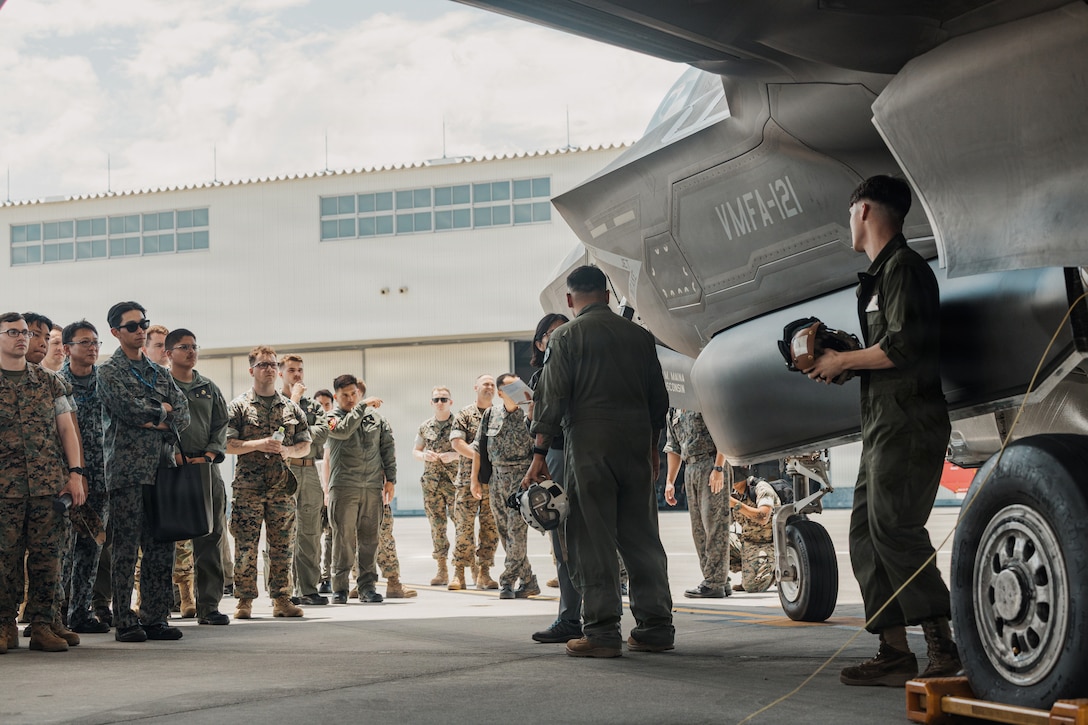 U.S. Marines stationed across the Indo-Pacific region and allied nations, examine a F-35B Lightning II aircraft assigned to Marine Fighter Attack Squadron (VMFA) 121, Marine Aircraft Group 12, 1st Marine Aircraft Wing, during Crash Damaged or Disabled Aircraft Recovery training at Marine Corps Air Station Iwakuni, Japan, June 1. 2026. CDDAR training is an annual training event held at MCAS Iwakuni by the F-35 Joint Program Office to bring multiple nations together to enhance aircraft recovery, rescue techniques, and capabilities across North Atlantic Treaty Organization Allies. (U.S. Marine Corps photo by Cpl. Sarah Grawcock)