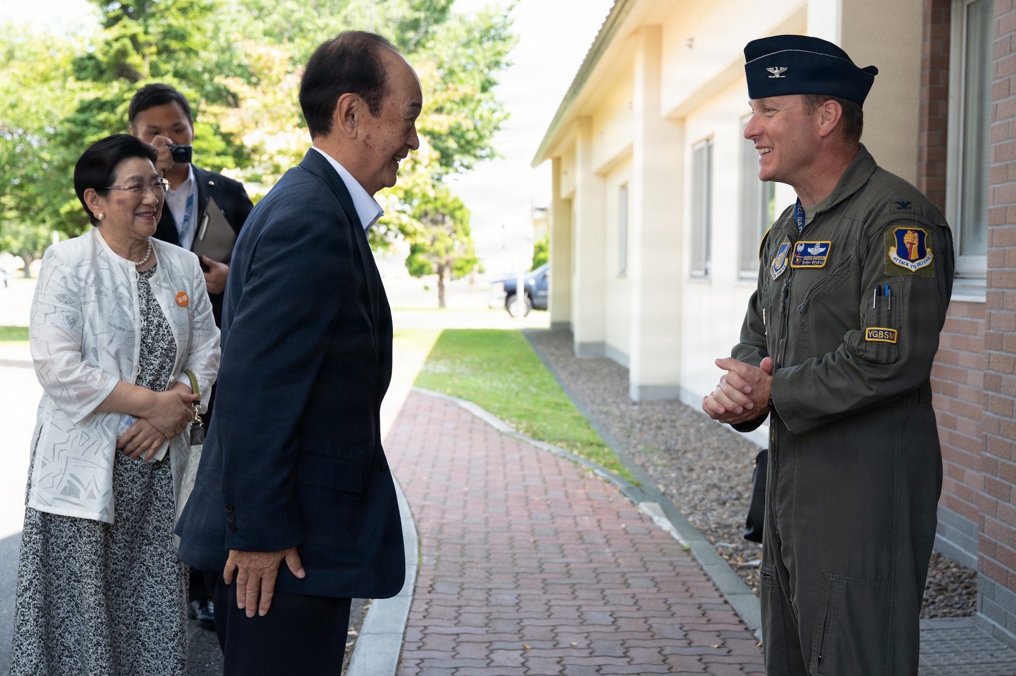 U.S. Air Force Col. Paul Davidson, 35th Fighter Wing (FW) commander, right, greets Misawa City Mayor Yoshinori Kohiyama upon his arrival at Misawa Air Base, Japan, July 1, 2026