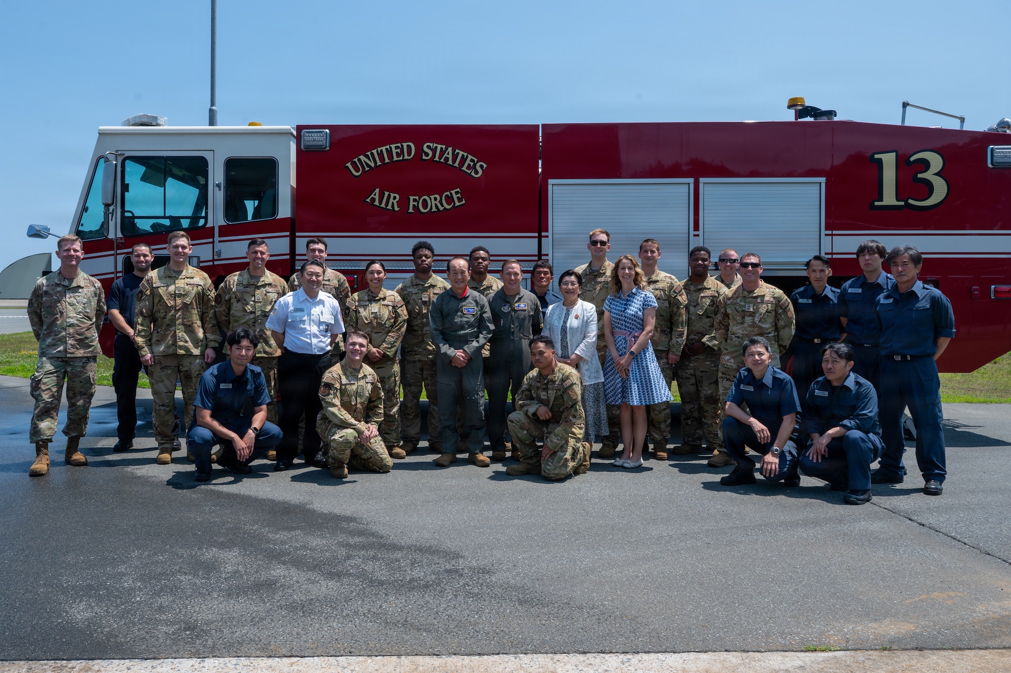 Misawa City Mayor Yoshinori Kohiyama and his wife, Junko Kohiyama, pose for a group photo with U.S. Air Force Col. Paul Davidson, 35th Fighter Wing (FW) commander, his wife, Megan Davidson, and members of the 35th Civil Engineer Squadron Fire Department during a Wing Commander for a Day tradition at Misawa Air Base, Japan, July 1, 2026