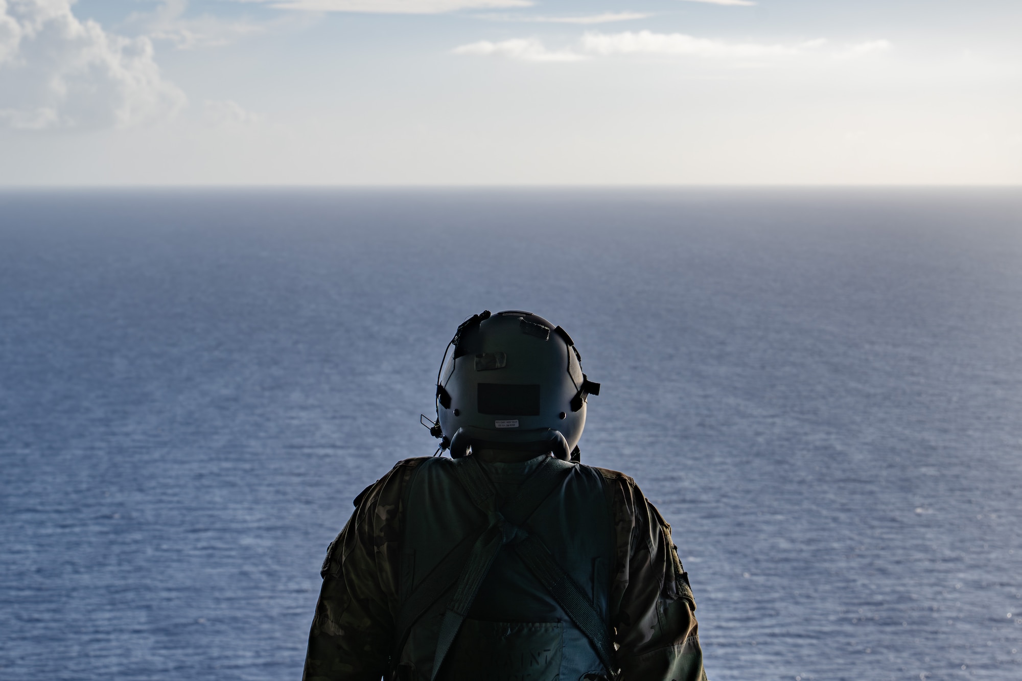 U.S. Air Force Airman 1st Class Samuel Hampton, 39th AS loadmaster, simulates sea rescue kit and Low Cost Low Altitude airdrops over the Philippine Sea, June 29, 2026, in support of VALIANT SHIELD 2026. Exercises like VALIANT SHIELD allow Pacific Command Joint Forces the opportunity to integrate forces from all branches of service and with our allies to conduct precise, lethal and overwhelming multi-axis, multi-domain effects that demonstrate the strength and versatility of the joint force and our commitment to a free and open Indo-Pacific. (U.S. Air Force photo by Airman 1st Class Caleb Schellenberg)